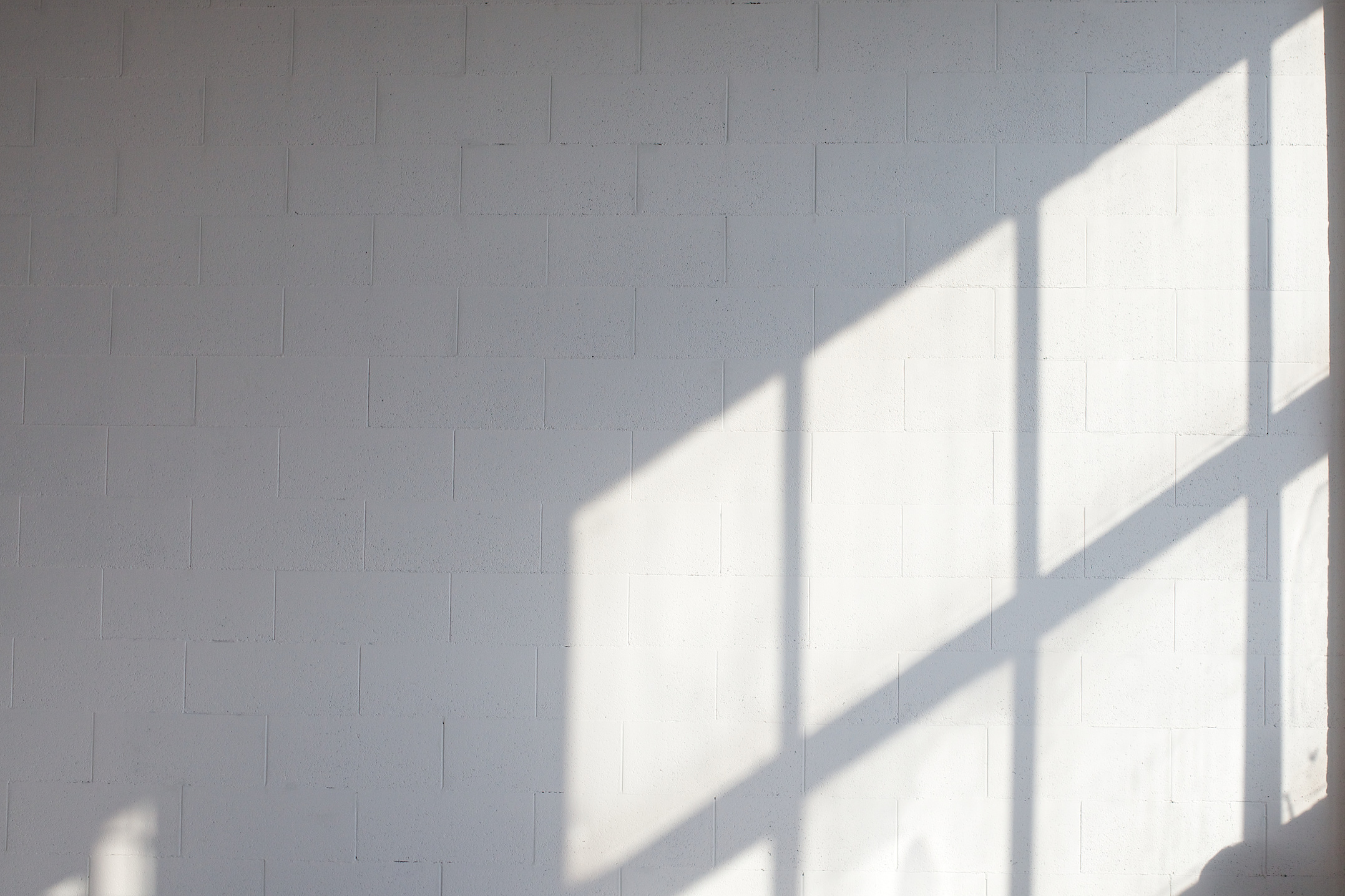 White empty loft interior with window shadow